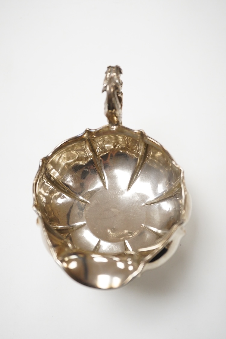 A George IV silver cream jug, with engraved monogram, by William, Charles and Henry Eley, London, 1824, height 10.5cm, 7.7oz.